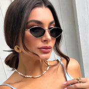 Dames Zonnebril met Slank Cat Eye Montuur en Metaalafwerking | Lonka